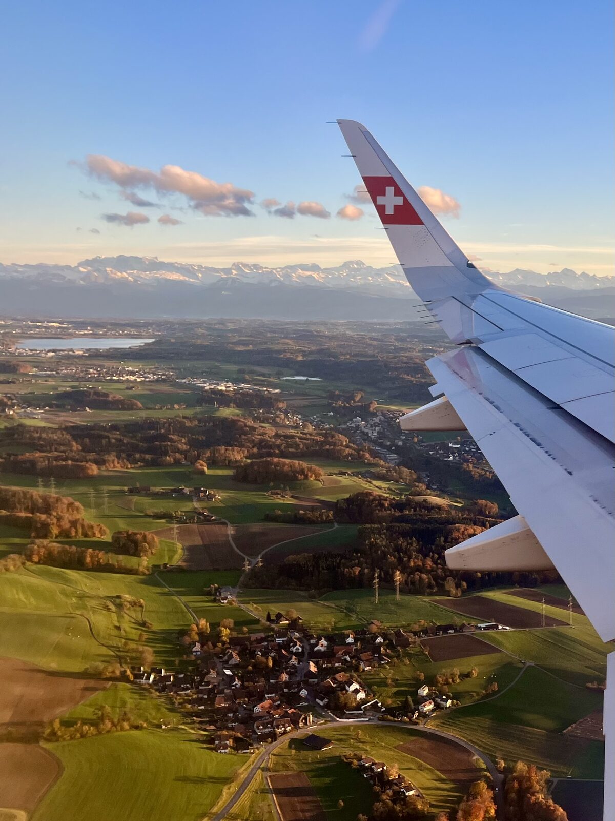 View from a plane wing over the Swiss countryside